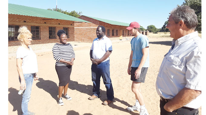 Former security guard helps build schools