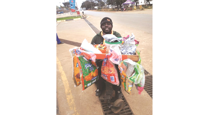 Determined physically challenged Mutumbe ekes a living from vending