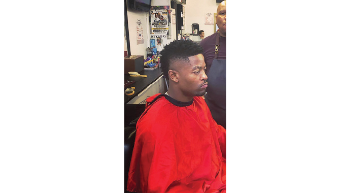No bad hair day in the city of Manchester. . .Not while Butholezwe, a barber from Bulawayo is around
