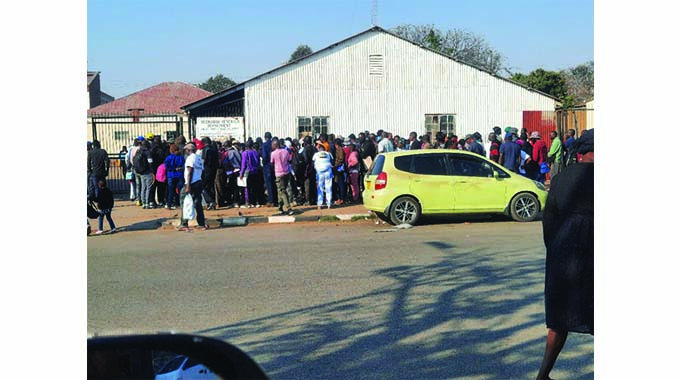 Voters stampede to get identity cards