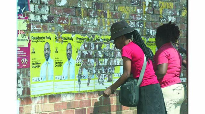 Political parties remove campaign posters around polling stations