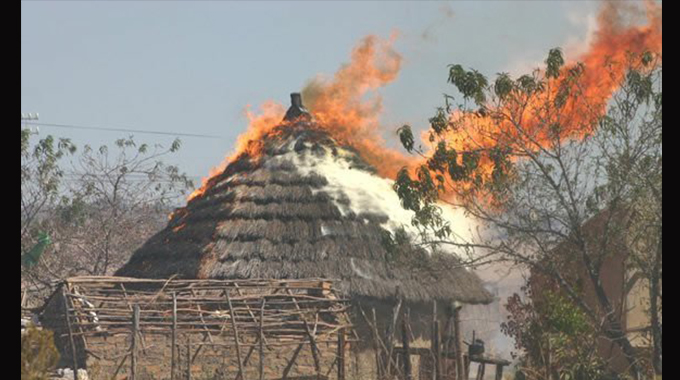 Man throws 5-year-old into blazing hut