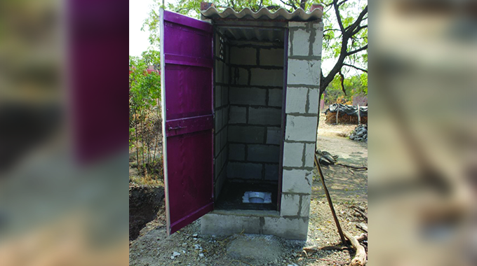Binga residents construct low cost latrines